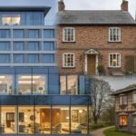 A photo collage with four images, showing different types of hotels or accommodations. The top-left image is a modern glass-and-steel building, the top-right is a traditional red brick cottage, the bottom-right is a rustic, timber-framed cottage, and the bottom-left is an interior shot of the modern hotel lobby.