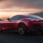 A sleek red Ferrari LUCE highlights its aerodynamic rear profile and glowing quad taillights against a mountain sunset.